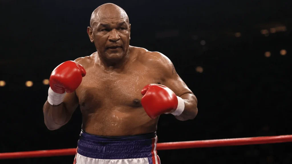 George Foreman net worth boxer in the ring during his 1990s comeback