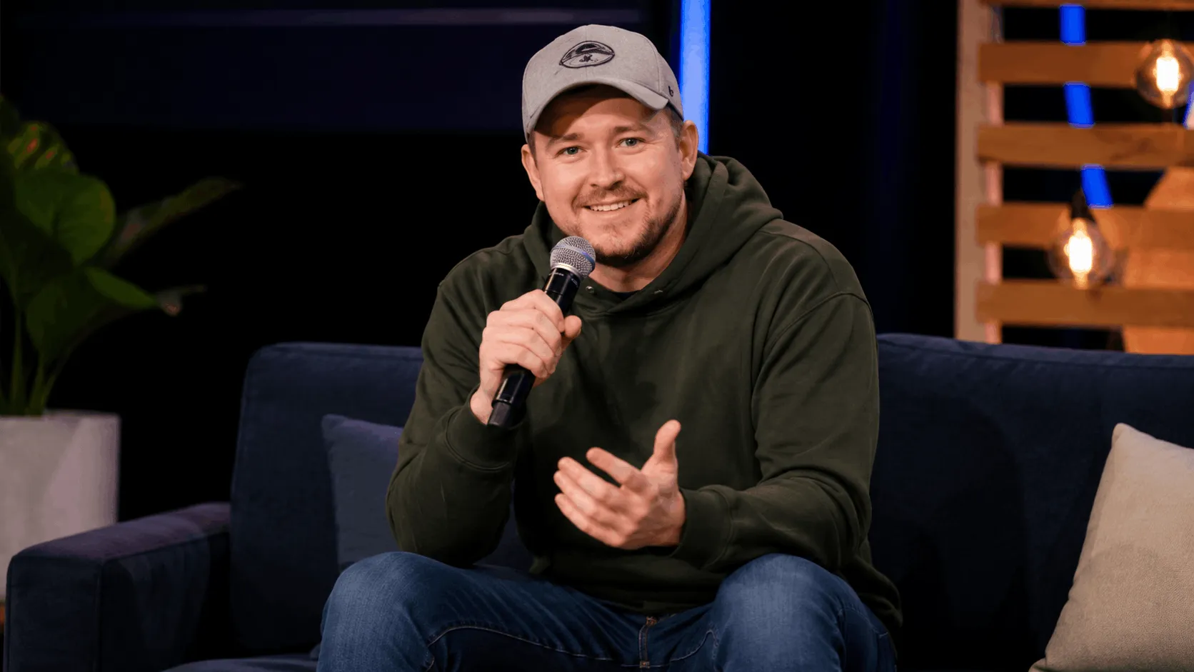 Shane Gillis net worth comedian performing stand-up on stage