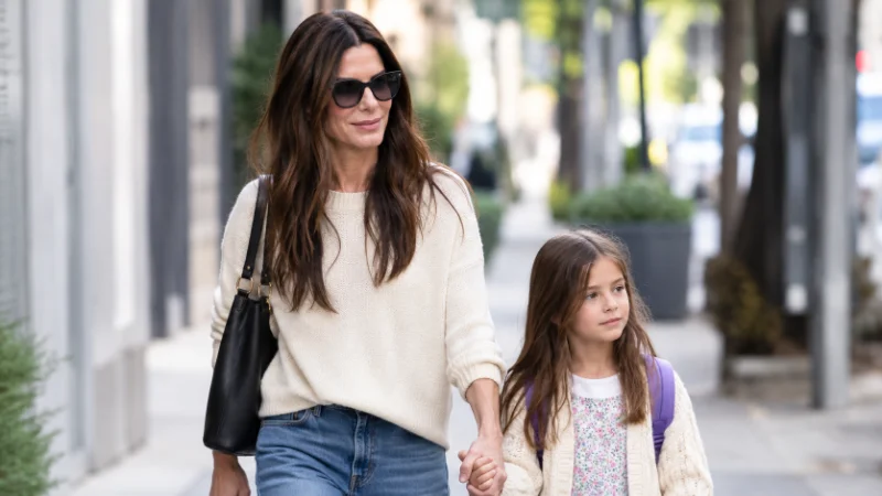 Sandra Bullock walking with her daughter